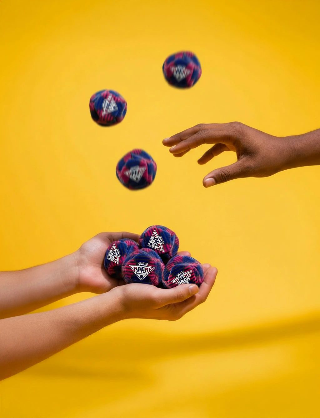 Hand catching Hacky Sack footbags