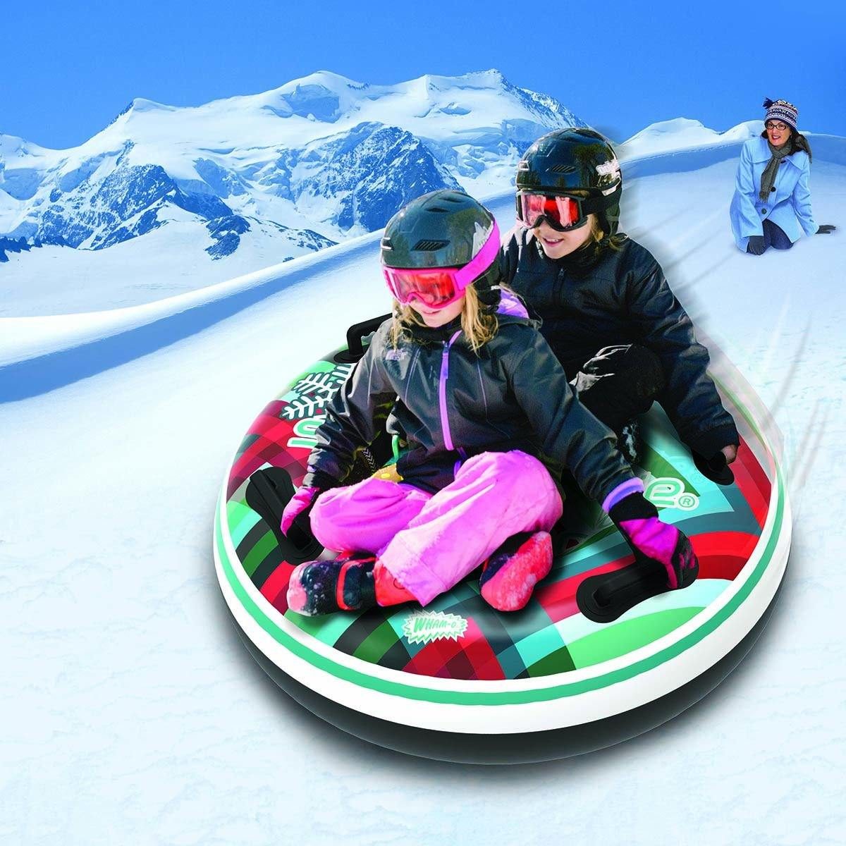 Kids sledding on a Snowboogie snow tube